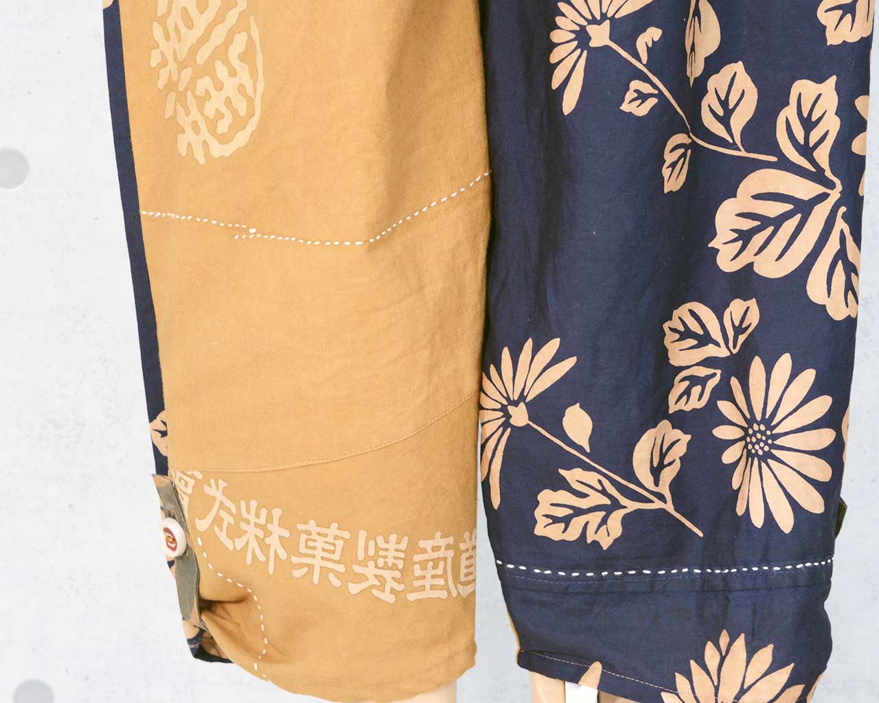 Persimmon-dyed pants made of tube-drawn cloth